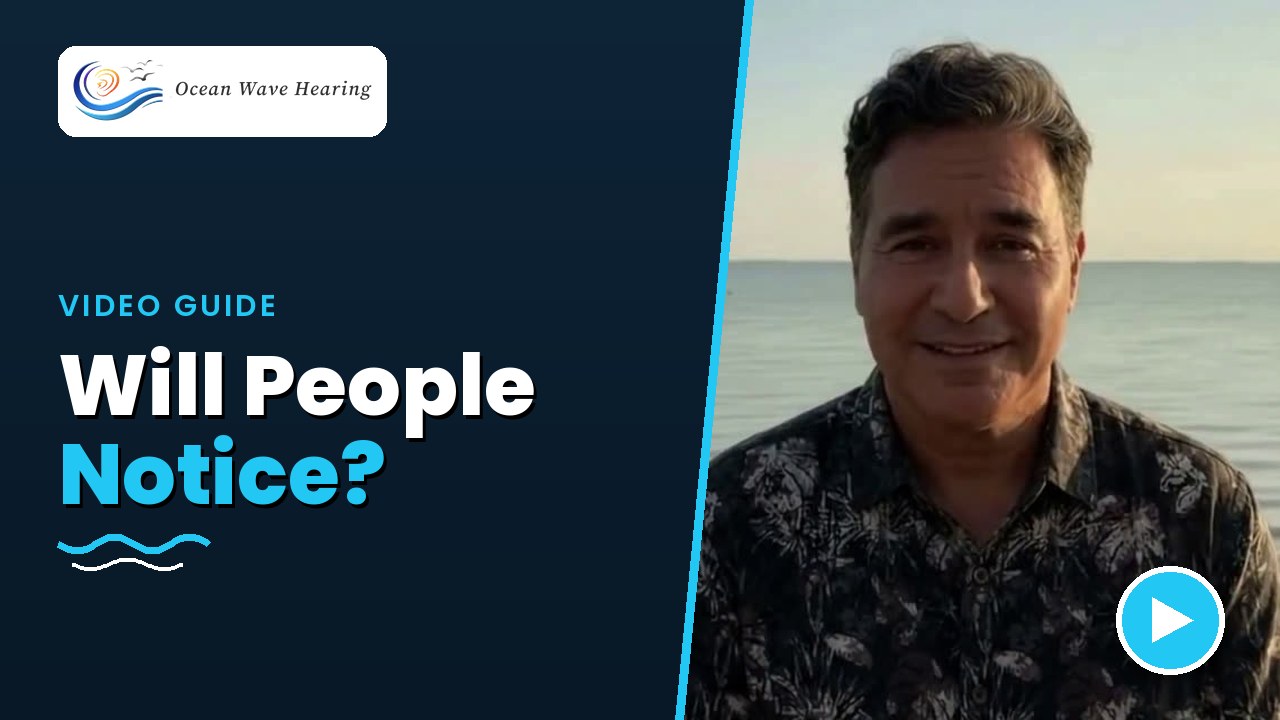 Ruben C. Cavazos, Jr. by the water in a video guide answering whether other people will notice your hearing aids
